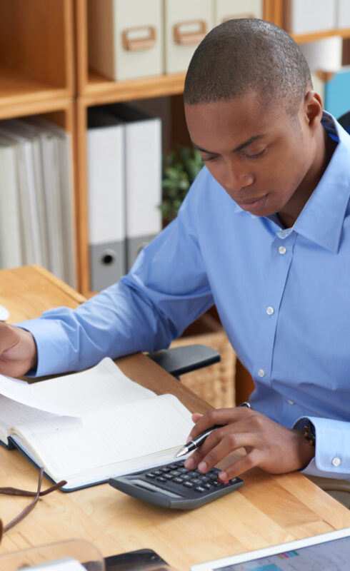 Businessman concentrated on work with financial document