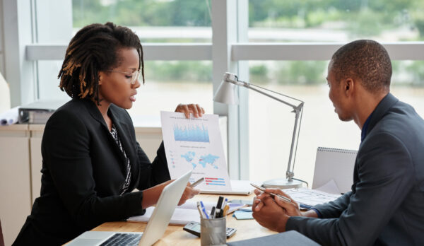Please have a look at this diagram Business woman showing diagram and explaining information to entrepreneur