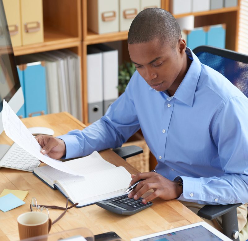 Businessman concentrated on work with financial document